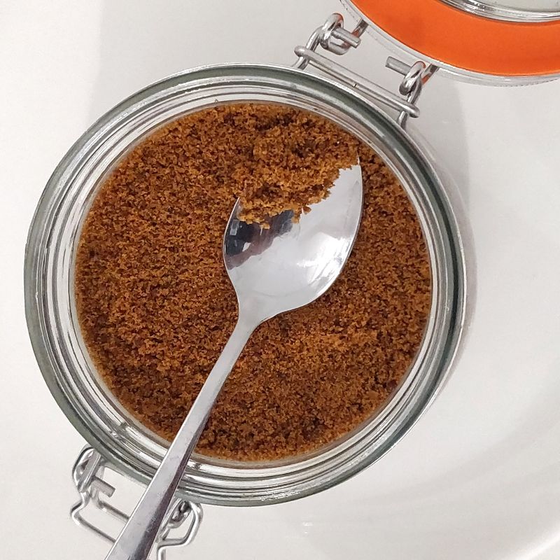 Installation view, direct-contact//feedback, granulated jaggery/gud, 2019